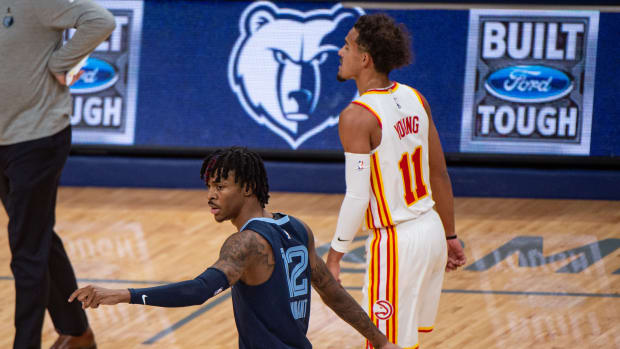Memphis Grizzlies guard Ja Morant and Atlanta Hawks guard Trae Young during a game.